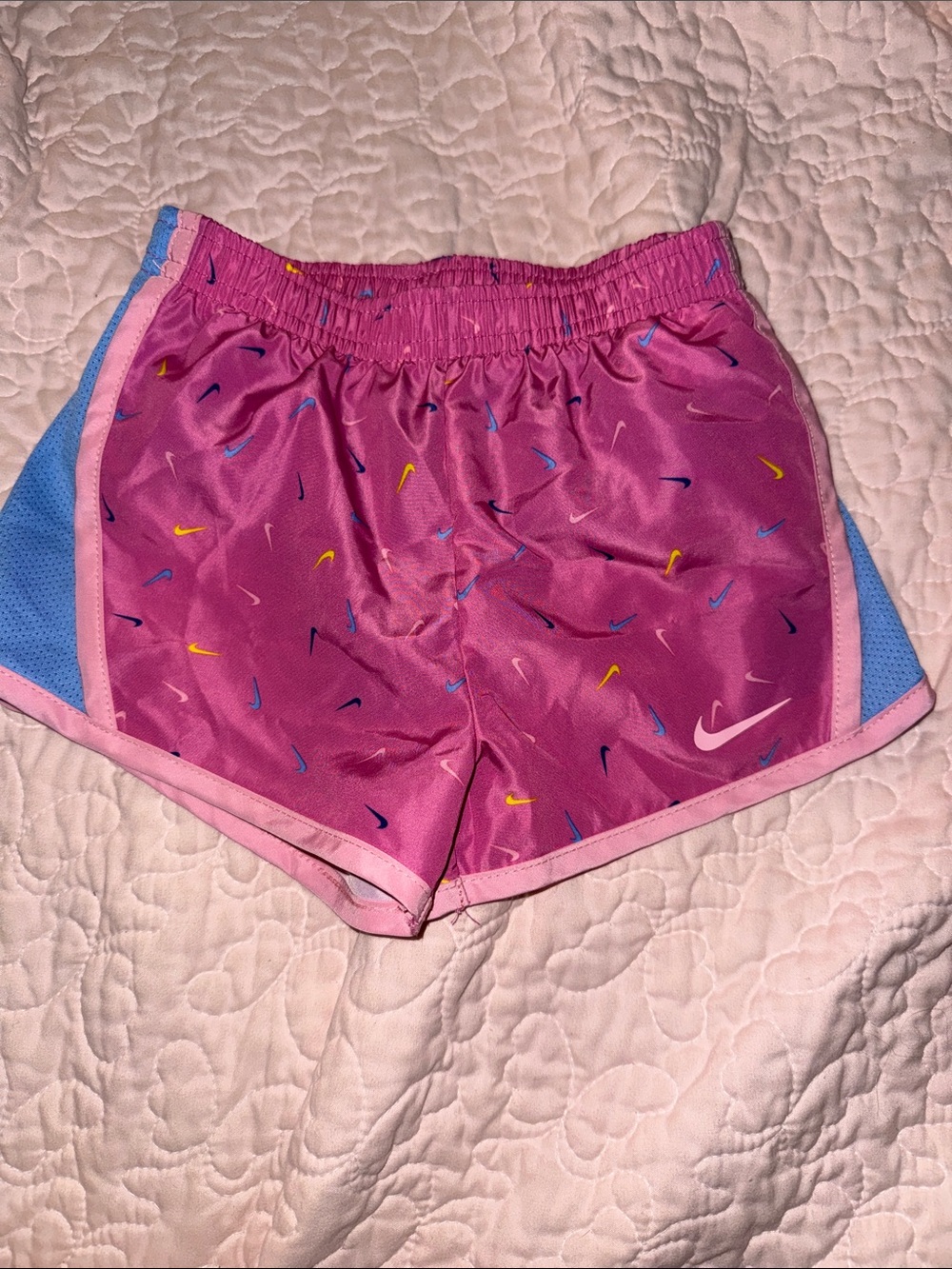 Nike Pink Girls' Shorts with Blue Side Panels and Multicolor Swooshes